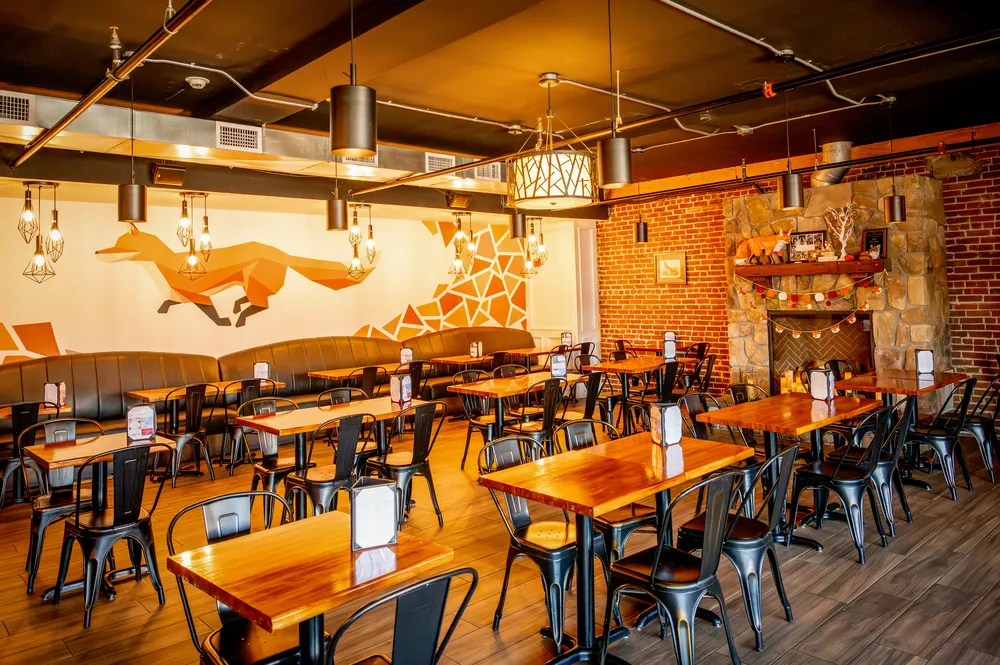 Dining room with the fox mural and fireplace